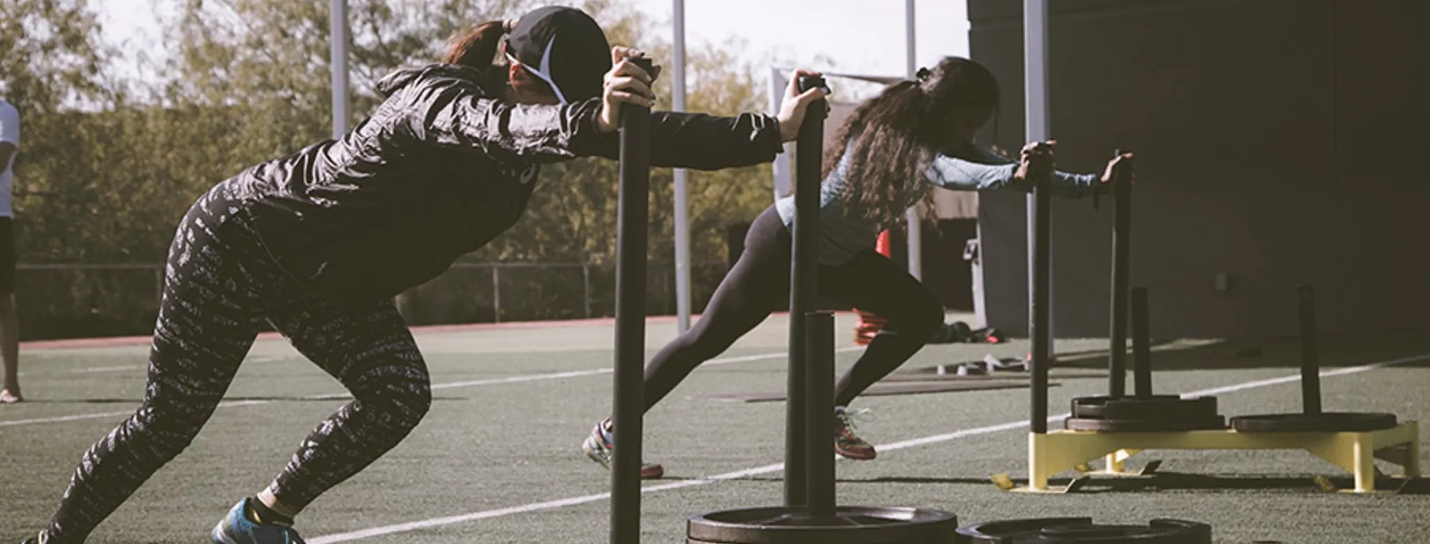 Women pushing weight sleds